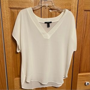Forever 21 ivory blouse. Size L V neck, short sleeve. Slightly rounded…